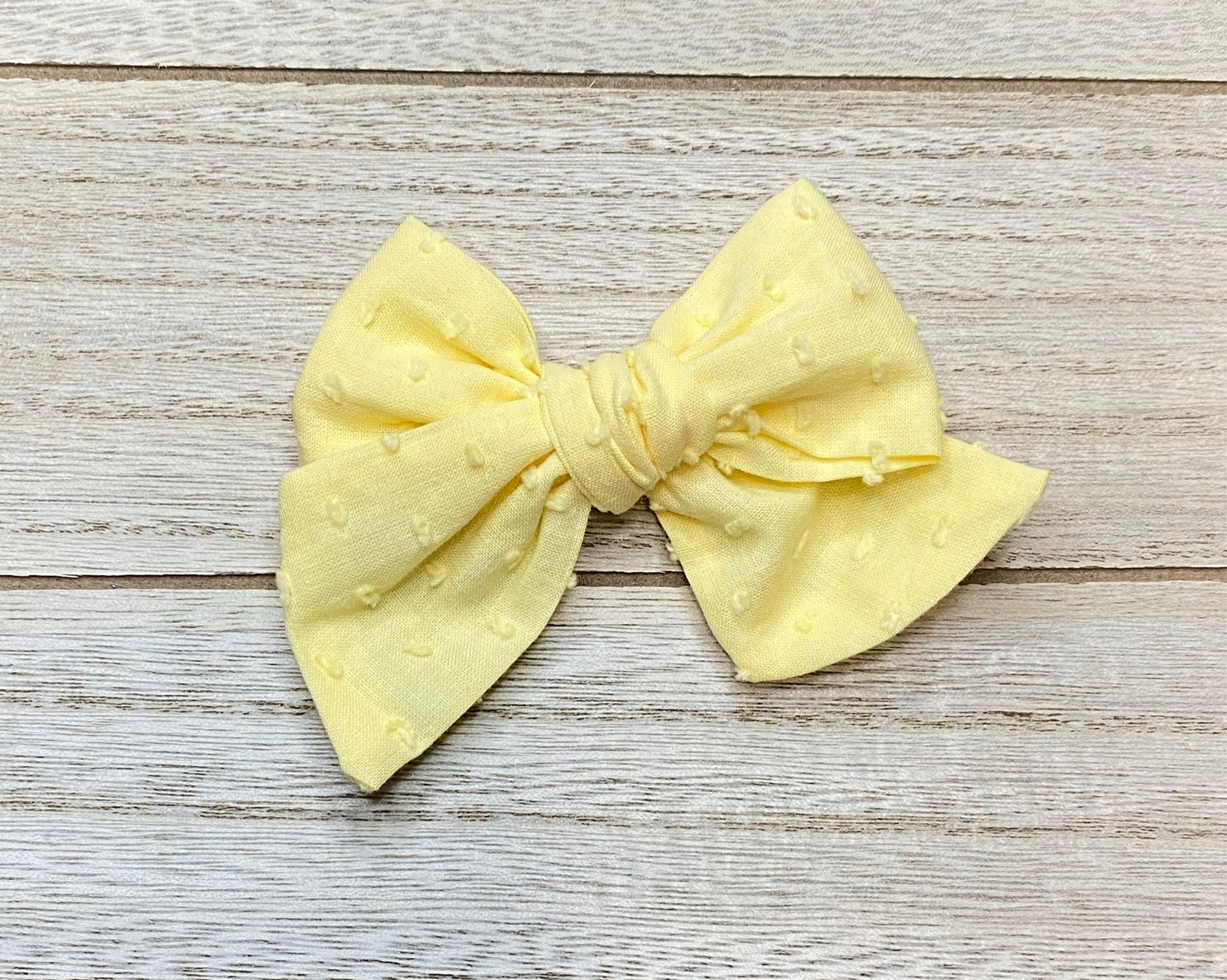 Yellow Swiss dot bow