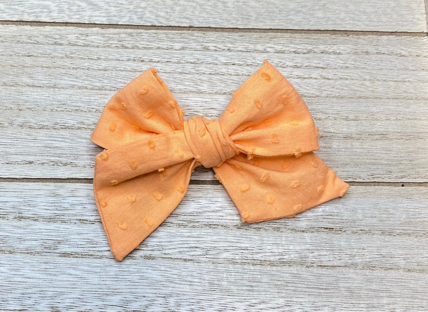 Carrot Swiss dot bow