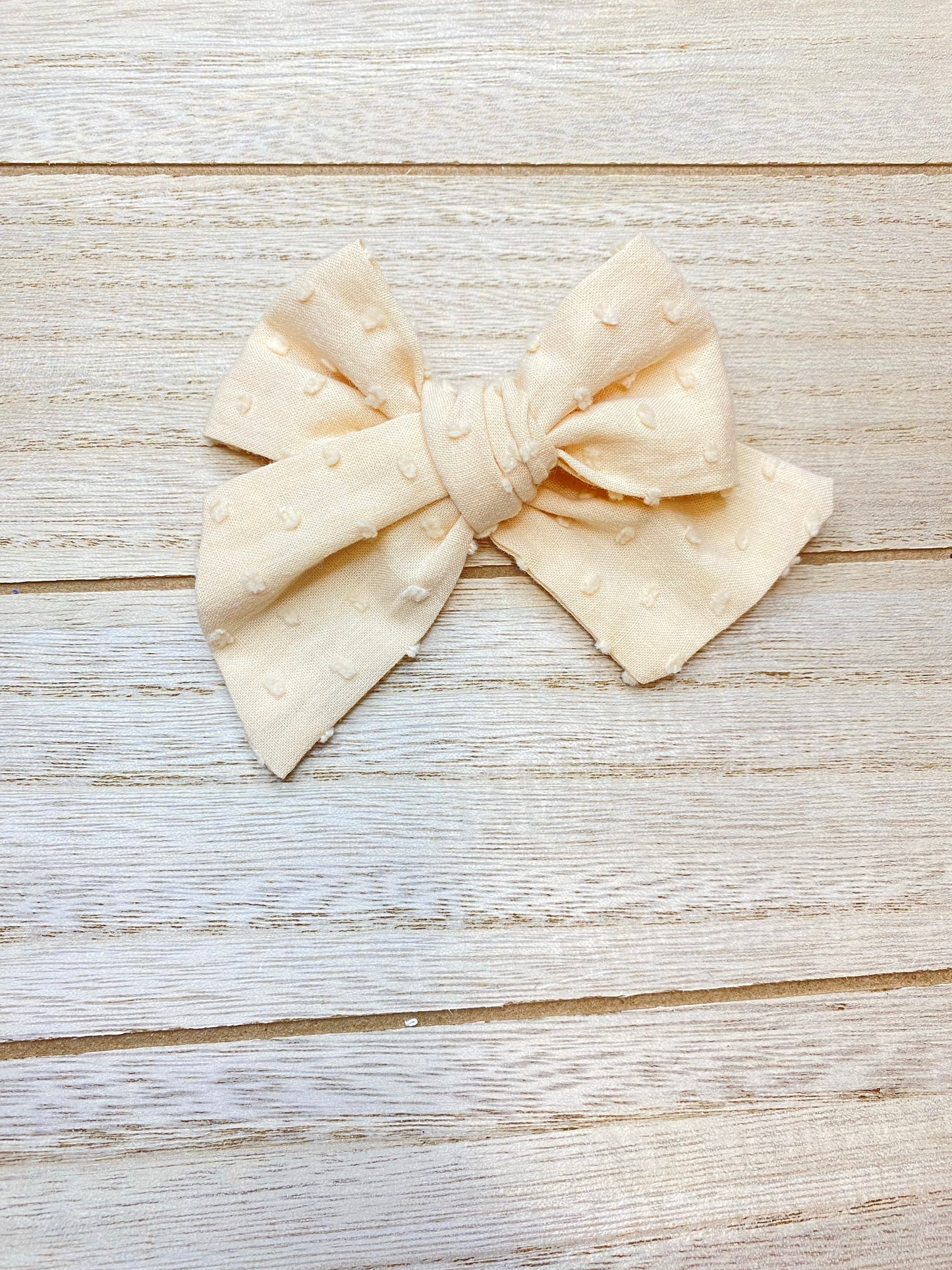Ivory Swiss dot bow