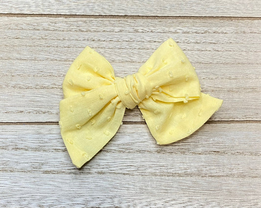 Yellow Swiss dot bow