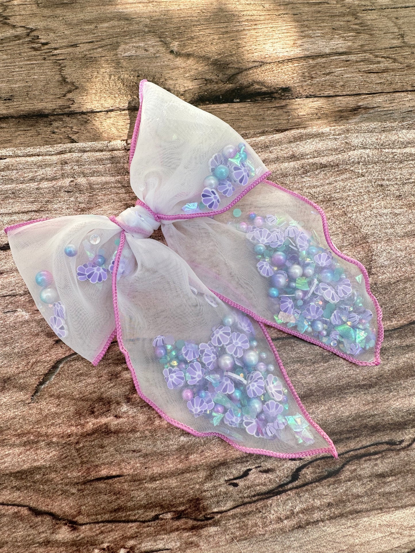 Mermaid shell shaker bow