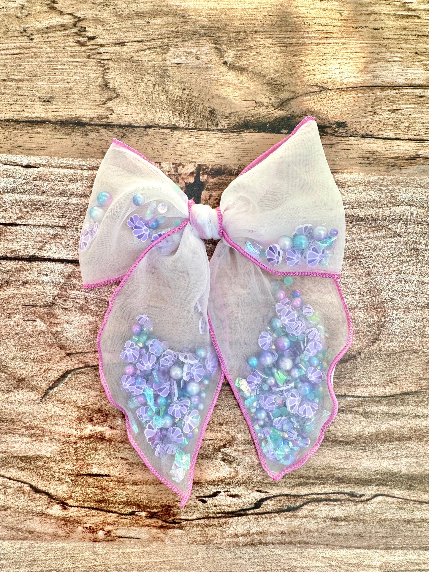 Mermaid shell shaker bow